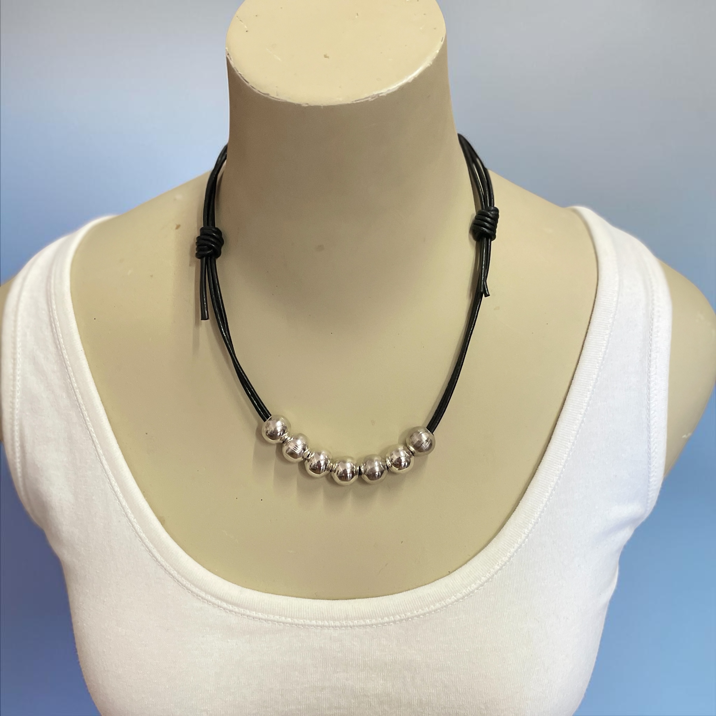 BLACK LEATHER NECKLACE WITH SILVER METAL BEADS by Wanita Stanley